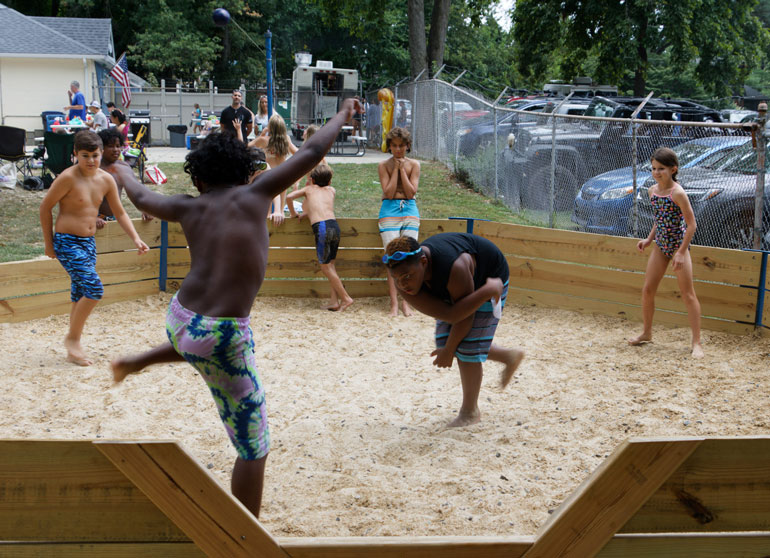Kids playing in a gaga pit at Fair Blue Swim Club